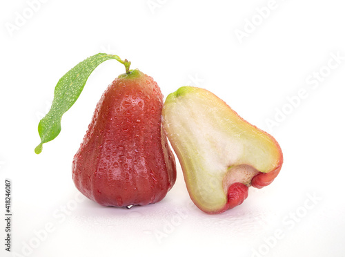 Isolated rose apple with water droplets on white background
