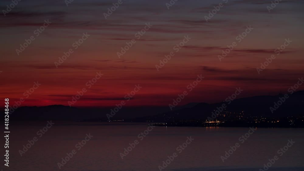 Seascape. Red sunset over sea coast. View from cliffs of Maro Cerro Gordo Natural Park, Malaga province, Costa Del Sol, Andalusia, Spain. Time lapse Seascape. Red sunset over sea coast. View from cliffs of Maro Cerro Gordo Natural Park, Malaga province, Costa Del Sol, Andalusia, Spain. Time lapse