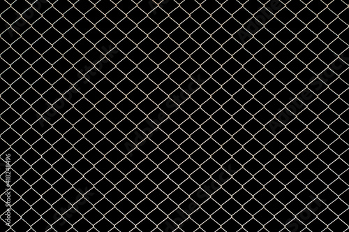 Wire mesh fence texture isolated on black background with clipping path