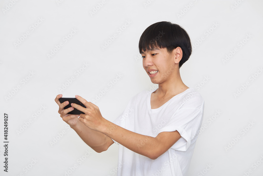 Young Asian man with a mobile phone Young Asian man with a mobile phone