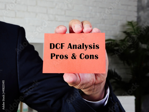  Financial concept meaning DCF Analysis Pros & Cons with inscription on the page. photo