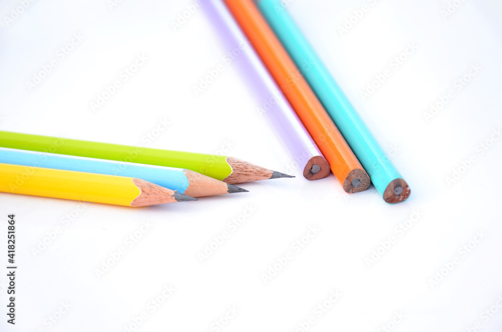 bunch the colorful wooden peels pencils isolated on white background. bunch the colorful wooden peels pencils isolated on white background.