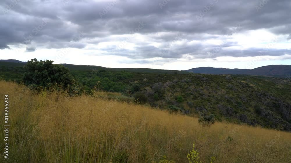 Calm water lake between valleys and mountains with cloudy sky and green vegetation. Madrid Atazar. Calm water lake between valleys and mountains with cloudy sky and green vegetation. Madrid Atazar.