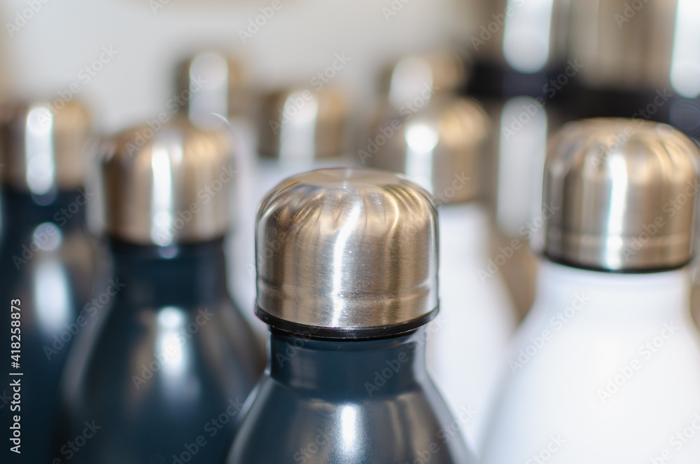 Bottles made of stainless steel, white and black. Bottles made of stainless steel, white and black.