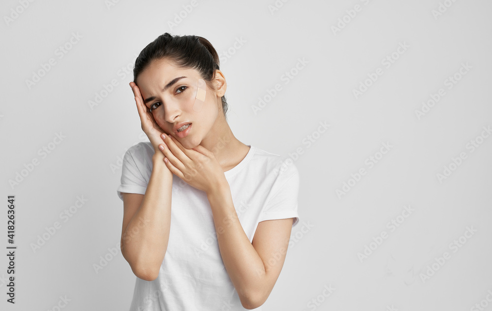woman in white t-shirt pills health problems medicine treatment woman in white t-shirt pills health problems medicine treatment