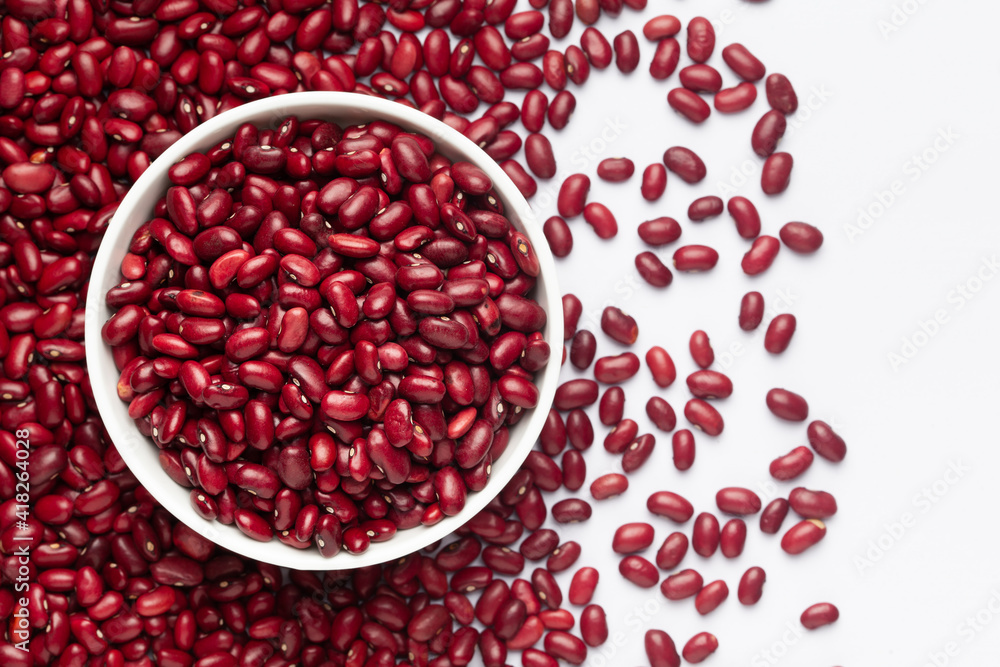 Close up of Organic Rajma, (Laal Lobia ) on a ceramic white bowl with the gradient background of red kidney beans dal. Top view Close up of Organic Rajma, (Laal Lobia ) on a ceramic white bowl with the gradient background of red kidney beans dal. Top view
