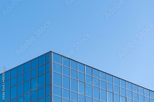Abstract texture of blue glass modern building skyscrapers. Business background. Copy space. Window glass pattern exterior of architecture office building. 