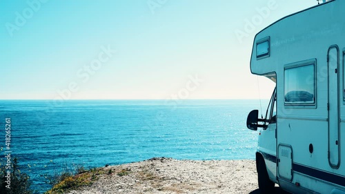 Camper rv camping on sea shore, Almeria province, Andalusia Spain. Traveling by motor home. Caravan vacation.