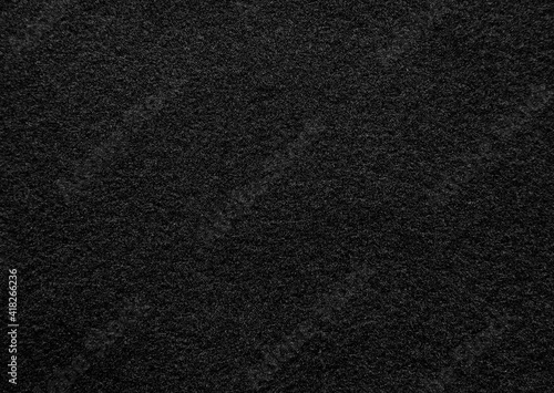 Black felt fabric texture background.