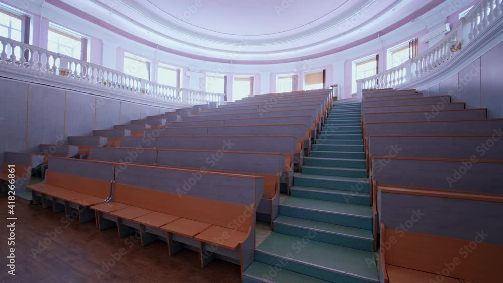 Wooden panelled university lecture theatre. Classroom with wooden furniture without student Wooden panelled university lecture theatre. Classroom with wooden furniture without student