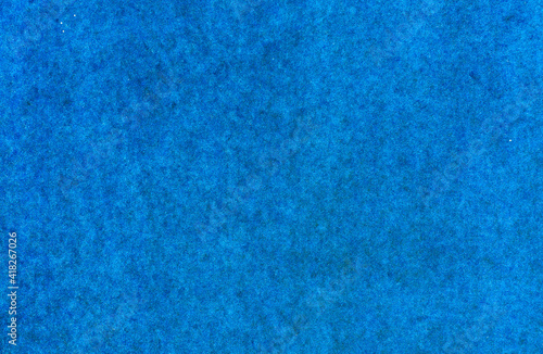 Seamless blue artificial lawn. Plastic turf carpet.