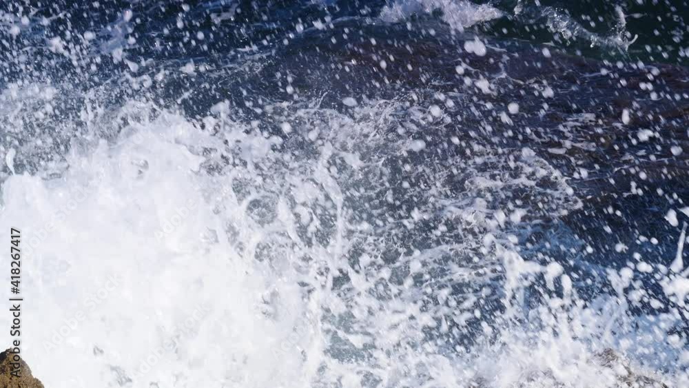 Big waves crashing on the rocks cliff. Slow motion. View from above Big waves crashing on the rocks cliff. Slow motion. View from above