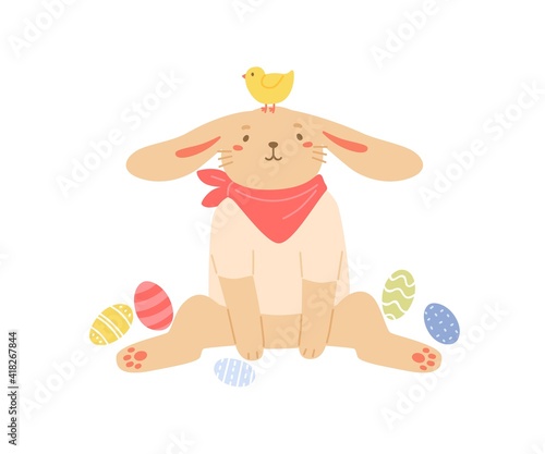 Cute bunny sitting with painted Easter eggs. Funny rabbit with chicken on its head. Colored flat vector illustration isolated on white background