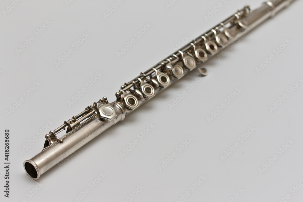 Fototapeta premium Flute lying diagonally on a white background