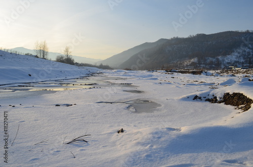 Winter landscape with the river in frosty day © maria