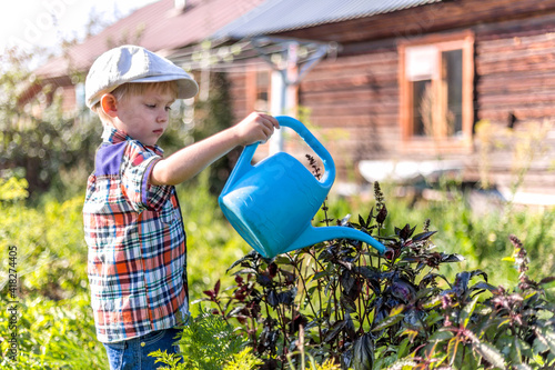 the child waters the garden helps parents