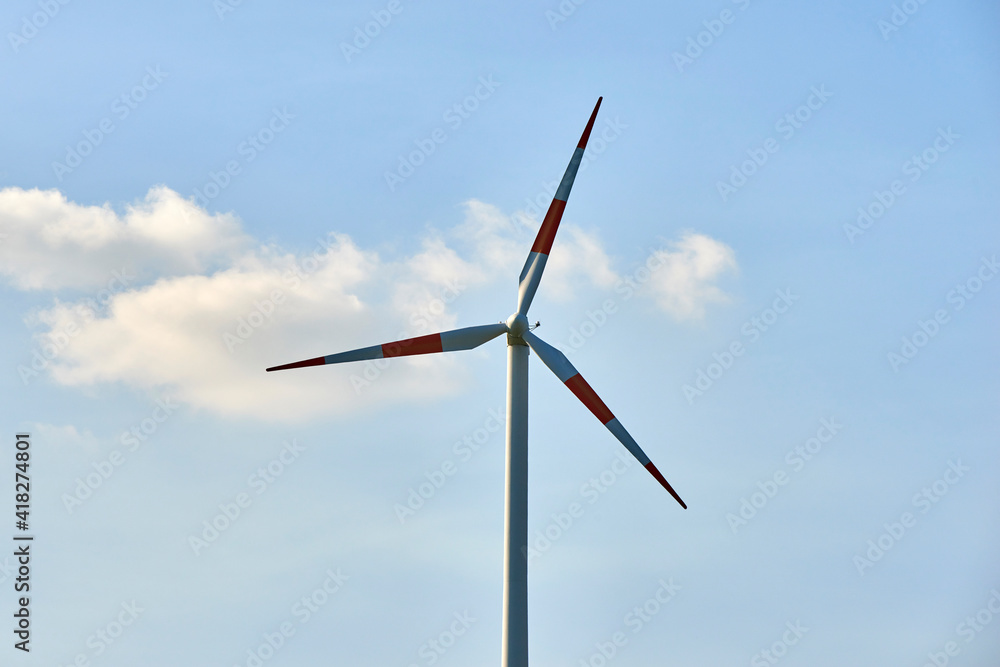 wind turbines of Central Sicily in a green landscape and immense pastures in spring in the warm hours of sunset wind turbines of Central Sicily in a green landscape and immense pastures in spring in the warm hours of sunset