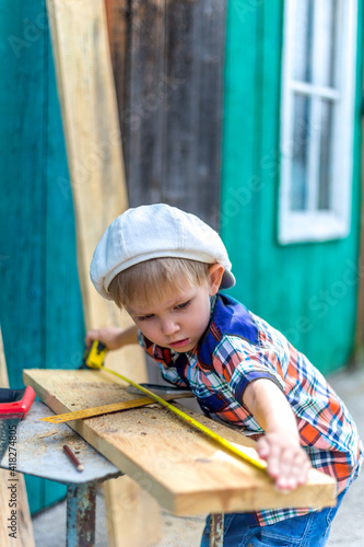 a small child helps cut otsu boards