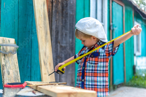 a small child helps cut otsu boards