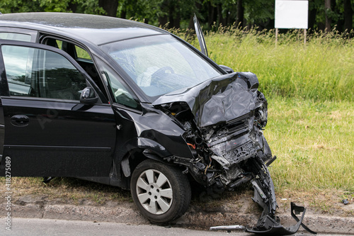 Auto accident. Crashed car in the street. Damaged car after collision