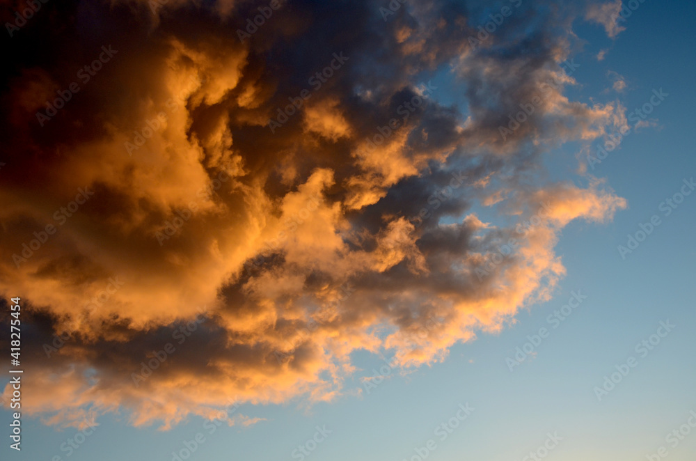 Fire in the clouds. Sunset sky. Abstract nature landscape background