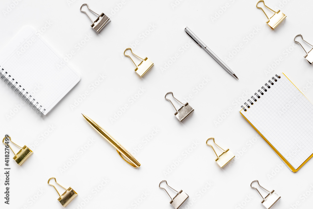 Paper binder clips. Stationery and office supplies background. Paper binder clips. Stationery and office supplies background.