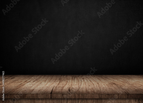 Wooden table on black wall in dark room background for product montage. 3d illustration.