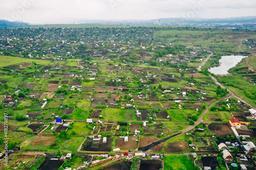 RUSSIA, krasnoyars - 13 JUN, 2020 Aerial view of cottages near the big wood photo