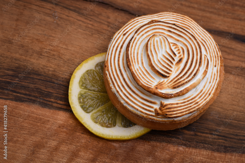 Tasty lemon meringue pie on wooden table, closeup Tasty lemon meringue pie on wooden table, closeup