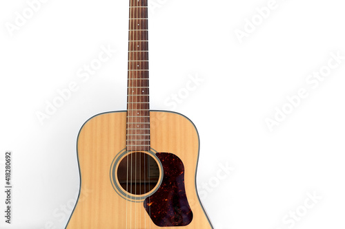 leisure, music and musical instruments concept - close up of acoustic guitar on window sill on white background