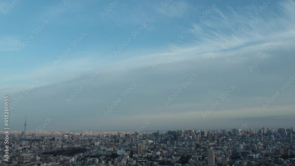 TOKYO, JAPAN : Aerial high angle sunset CITYSCAPE of TOKYO. View of buildings at central downtown area. Japanese city life and urban metropolis concept. Long time lapse tracking shot, dusk to night. TOKYO, JAPAN : Aerial high angle sunset CITYSCAPE of TOKYO. View of buildings at central downtown area. Japanese city life and urban metropolis concept. Long time lapse tracking shot, dusk to night.