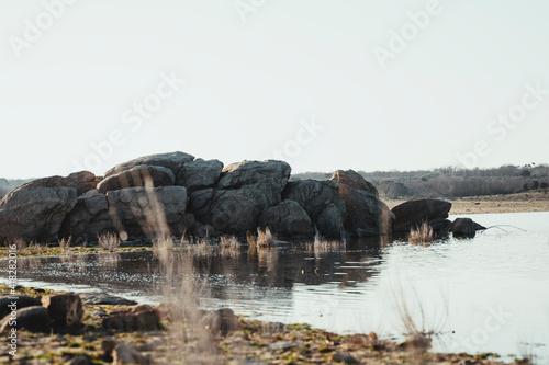 a landscape of rocks in a lake