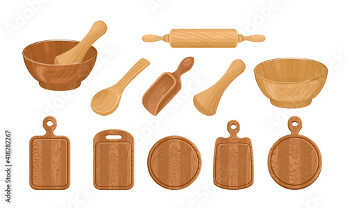 Set of wooden dishes, kitchen utensils isolated on white background. Vector illustration of bowl, rolling pin, mortar and pestle, spoon, scoop, cutting boards of different shapes. Cartoon flat style.