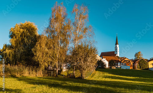 Beautiful autumn or indian summer view with a church near castle Arnstorf, Bavaria, Germany