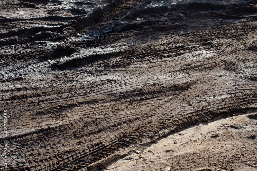 dirt on the road with wheels from cars. Lots of dirt dirty roads autumn