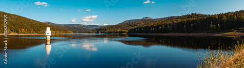 High resolution stitched panorama of a beautiful autumn or indian summer view with reflections at the famous drinking water reservoir Frauenau, Bavarian forest, Bavaria, Germany