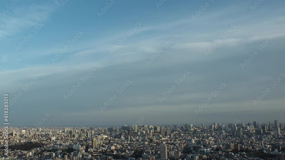 TOKYO, JAPAN : Aerial high angle sunset CITYSCAPE of TOKYO. View of buildings at central downtown area. Japanese city life and urban metropolis concept. Long time lapse tracking shot, dusk to night. TOKYO, JAPAN : Aerial high angle sunset CITYSCAPE of TOKYO. View of buildings at central downtown area. Japanese city life and urban metropolis concept. Long time lapse tracking shot, dusk to night.