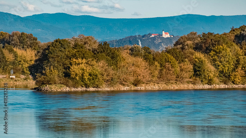 Beautiful autumn or indian summer view with the famous Bogenberg in the background at the danube lock near Straubing, Bavaria, Germany