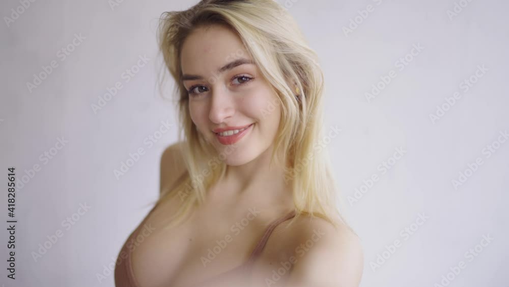 Friendly blond female smiling for camera Friendly blond female smiling for camera