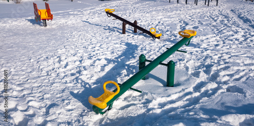 playground in winter on a sunny day