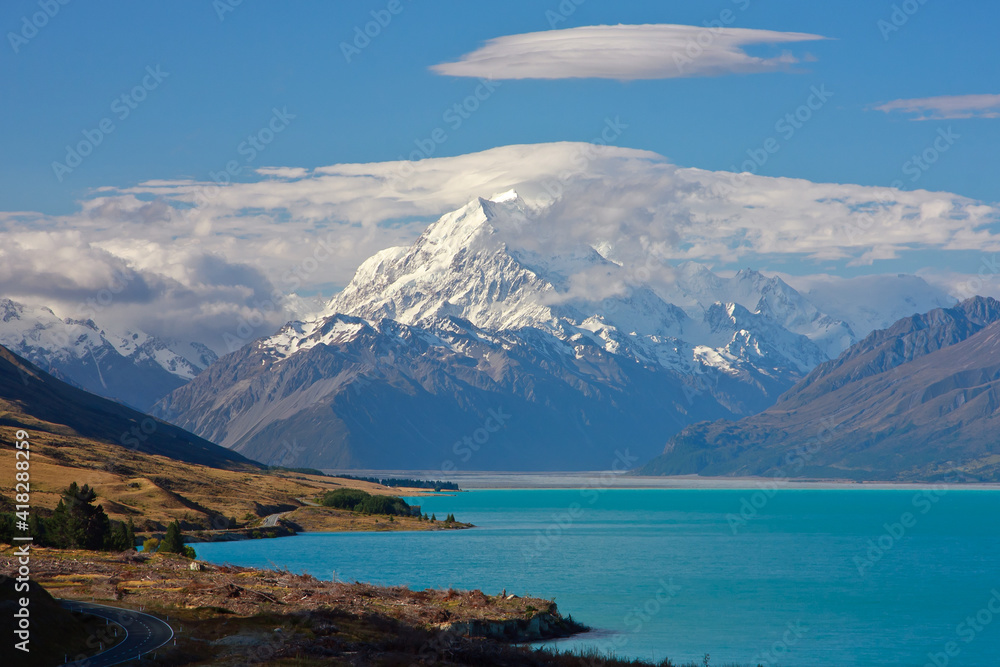 Mount Cook in evening light with clouds on summit