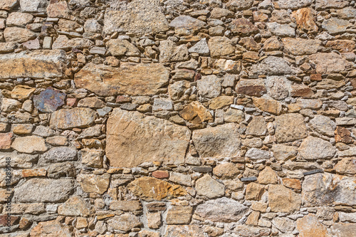 Architecture textures, detailed and rustic of paired masonry granite wall