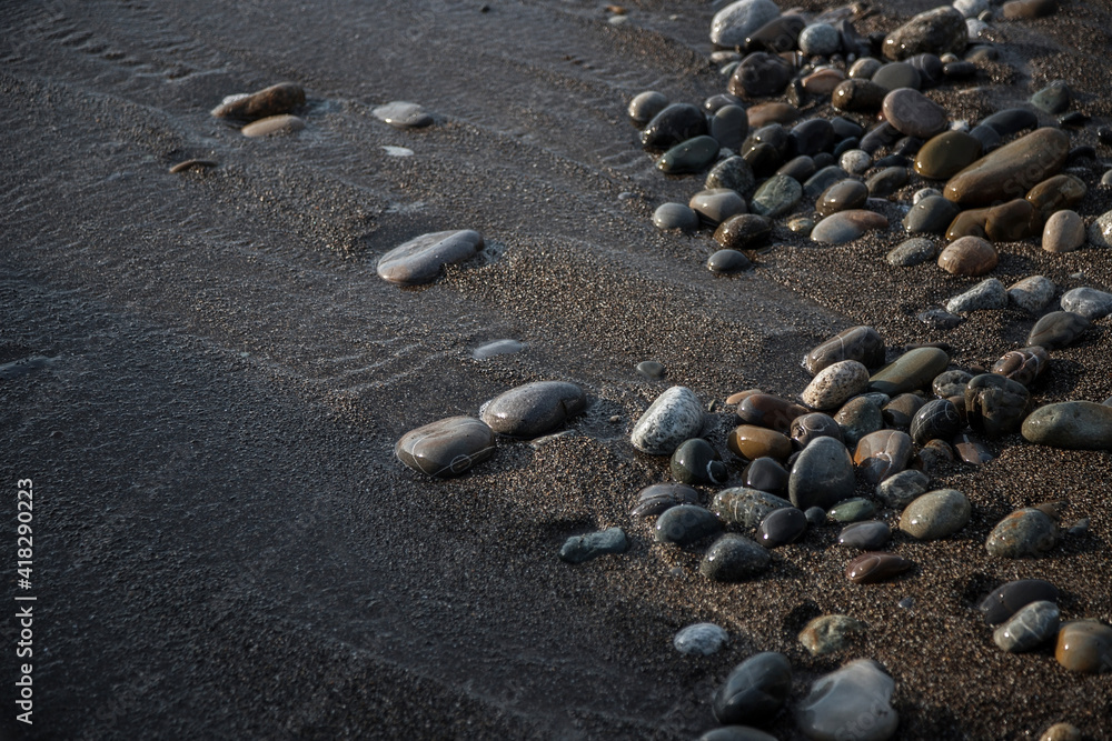 Sea shore with stones and foam, pebble seascape. Sea shore with stones and foam, pebble seascape.
