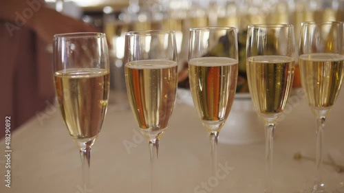 Buffet area at the event. Glasses of champagne are waiting for guests.