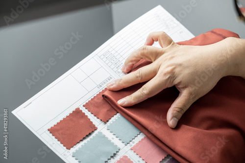 Detail of employee working in Chinese clothing factory