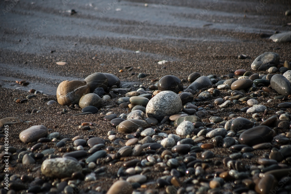 Sea shore with stones and foam, pebble seascape. Sea shore with stones and foam, pebble seascape.