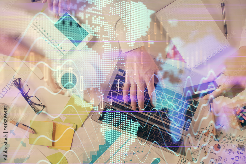 Multi exposure of man's hands typing over computer keyboard and forex graph hologram drawing. Top view. Financial markets concept. Multi exposure of man's hands typing over computer keyboard and forex graph hologram drawing. Top view. Financial markets concept.