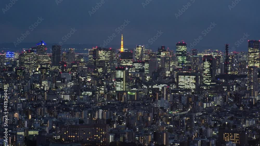 TOKYO, JAPAN : Aerial high angle sunset CITYSCAPE of TOKYO. View of office buildings around crowded downtown area. Japanese business and metropolis concept. Long time lapse tracking shot dusk to night TOKYO, JAPAN : Aerial high angle sunset CITYSCAPE of TOKYO. View of office buildings around crowded downtown area. Japanese business and metropolis concept. Long time lapse tracking shot dusk to night