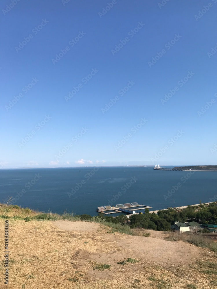 Obraz premium sea, beach, sky, water, coast, blue, ocean, landscape, island, summer, nature, travel, view, coastline, sand, shore, bay, green, greece, vacation, lake, mountain, horizon, clouds, scenic