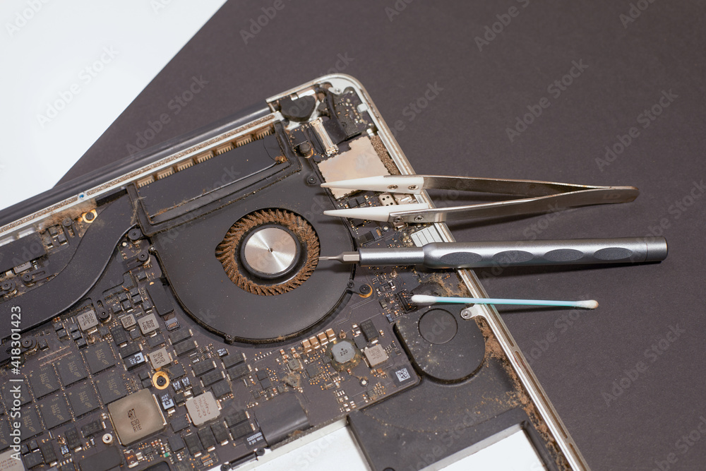 Battery replacement and repair with cleaning of a laptop with different backgrounds 